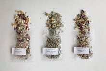 Load image into Gallery viewer, Three bath tea sample pouches with dried botanicals on a white background.