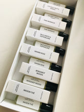 Load image into Gallery viewer, Set of small perfume bottles with labels in a white box