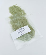 Load image into Gallery viewer, Sample pouch of Ocean Purify bath soak with green mineral salts spilled on a clean white background.