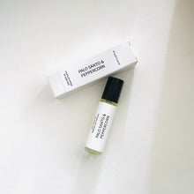 Load image into Gallery viewer, Palo Santo & Peppercorn perfume oil roller bottle with matching minimalist white box on a light background