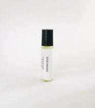Load image into Gallery viewer, Sahara Rose perfume oil roller bottle with minimalist white label and black cap