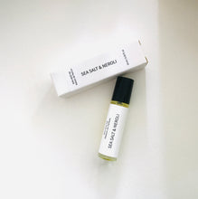 Load image into Gallery viewer, Sea Salt & Neroli perfume oil roller bottle with matching minimalist white box on a light background
