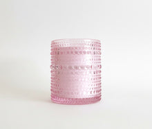 Load image into Gallery viewer, Rose and Peony scented soy candle in pink hobnail glass jar on white background.