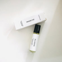 Load image into Gallery viewer, Maison Thé perfume oil roller bottle with matching minimalist white box on a light background.