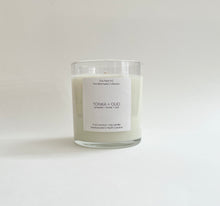 Load image into Gallery viewer, Tonka and Oud natural wax candle on a white background, hand-poured in Wilmington, North Carolina