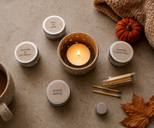 Load image into Gallery viewer, Fall tealight candle set featuring Autumn in My Heart, Fall in Love, Pumpkin Everything and Spiced Maple in a cozy autumn setting.