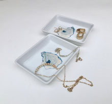 Load image into Gallery viewer, Two white trinket dishes with necklaces and earrings on a white background