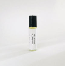 Load image into Gallery viewer, Palo Santo &amp; Peppercorn perfume oil roller bottle with minimalist white label and black cap
