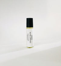 Load image into Gallery viewer, Coconut Milk &amp; Mango perfume oil roller bottle with minimalist white label and black cap
