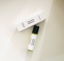 Load image into Gallery viewer, Southern Magnolia roller bottle with matching minimalist white box on a light background.
