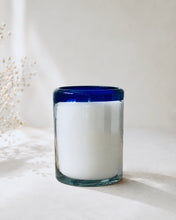 Load image into Gallery viewer, Sunset Margarita candle in a handcrafted 100% recycled Mexican artisan glass with a cobalt blue rim, hand-poured soy candle on a soft white background.
