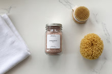 Load image into Gallery viewer, Harbor Reset bath soak jar on a white marble surface with a dry brush, white towel, and sea sponge.
