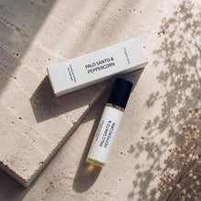 Load image into Gallery viewer, PALO SANTO &amp; PEPPERCORN perfum oil from Maison de Parfum collection with matching box, styled on a light stone surface with soft botanical shadows.
