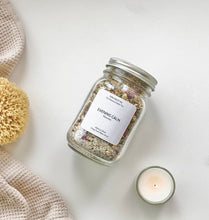 Load image into Gallery viewer, Evening Calm bath tea jar on a white surface with sea sponge, towel, and tealight.
