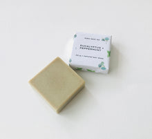 Load image into Gallery viewer, Olive green handmade soap bar with eucalyptus and peppermint scent packaging displayed on a clean white surface.
