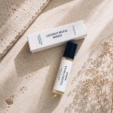 Load image into Gallery viewer, COCONUT MILK &amp; MANGO perfume oil from Maison de Parfum collection with  matching white box on a textured beige stone surface with soft shadows and dried flowers.
