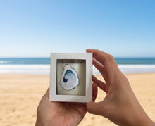 Load image into Gallery viewer, Person holding a candle box aganst beach background
