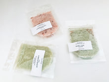Load image into Gallery viewer, Three sample pouches of bath salts laid flat on a white background.
